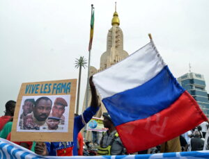 Malians hold an image with coup leader leader Goita during a pro-FAMA  demonstration in Bamako